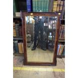 An antique mahogany and parcel gilt framed rectangular wall mirror, 88 x 57cm.