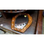 An old carved oak framed horseshoe mirror; together with another mirrored stand.