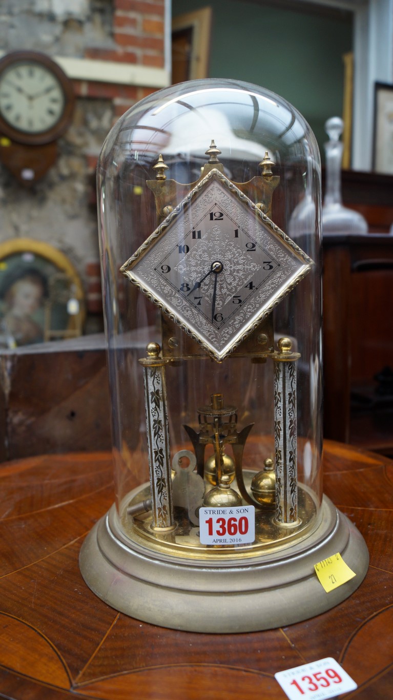 A vintage anniversary clock and glass dome, 30cm high.
