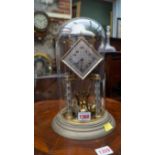 A vintage anniversary clock and glass dome, 30cm high.
