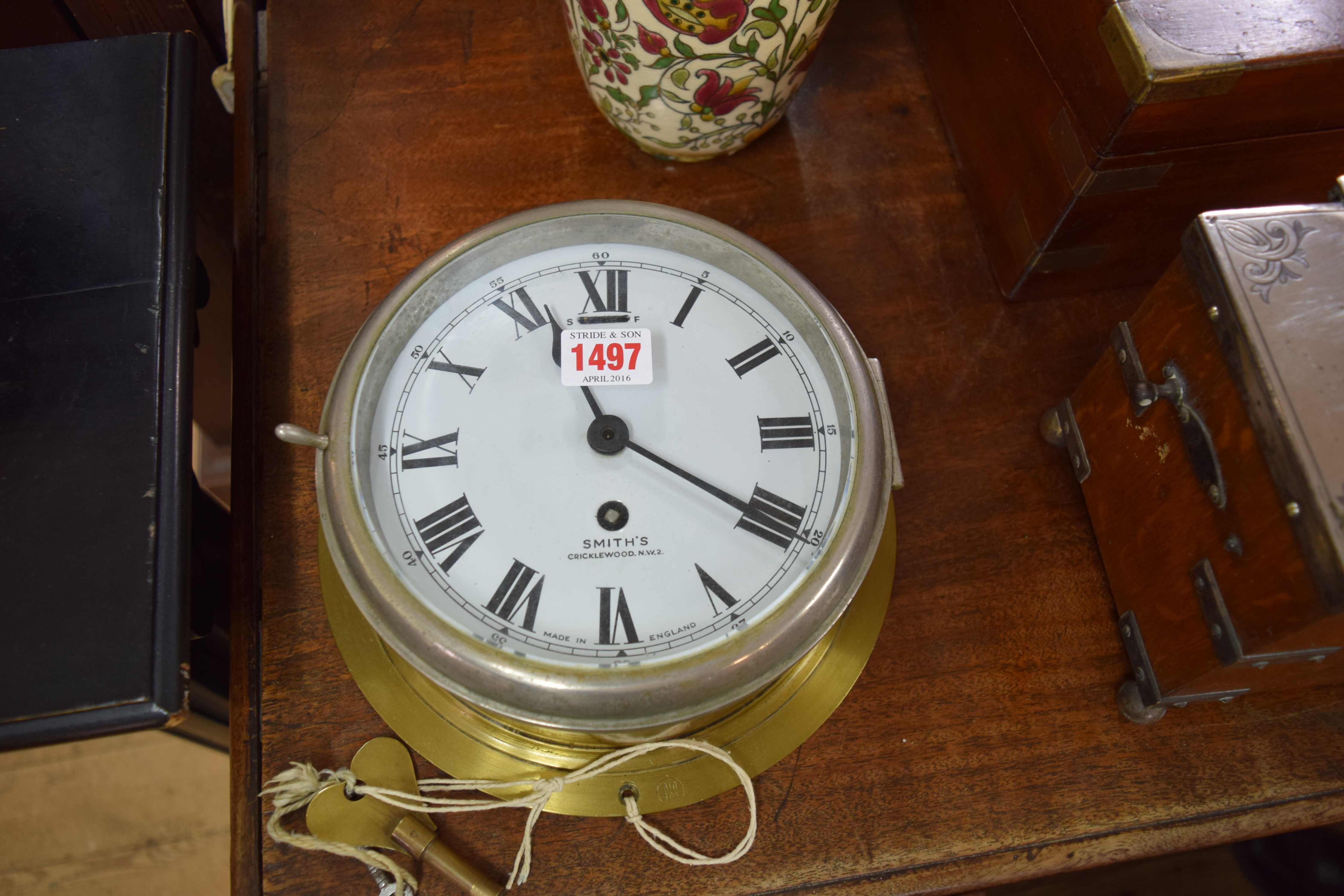 An old brass and nickel plated Smiths bulkhead timepiece, with 6½ inch enamel dial, with two keys.
