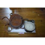 A late Victorian large brass cased pocket barometer, in original fitted leather case.