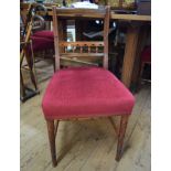 A set of late Victorian carved walnut dining chairs.