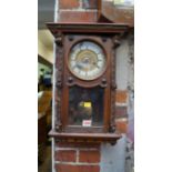 A circa 1900 Continental walnut wall clock.