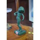 An Art Deco style Danish green glazed pottery figure of a young girl, 22cm high.