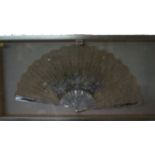 Two antique fans, comprising a mother and pearl and watercolour painted example, the guard 33.