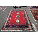 A Hamadan rug, having three central diamonds, 220 x 158cm.