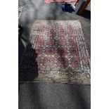 An old Persian rug, having allover floral pattern, 207 x 147cm.