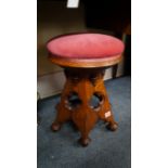 A good Victorian Gothic adjustable piano stool,