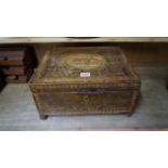 An early 19th century stencilled sewing casket, with gilt brass ball feet, 34.5cm wide.