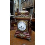 A mahogany and brass mantel clock, 34cm high.