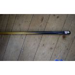 A vintage ash and ebony one piece billiard cue,