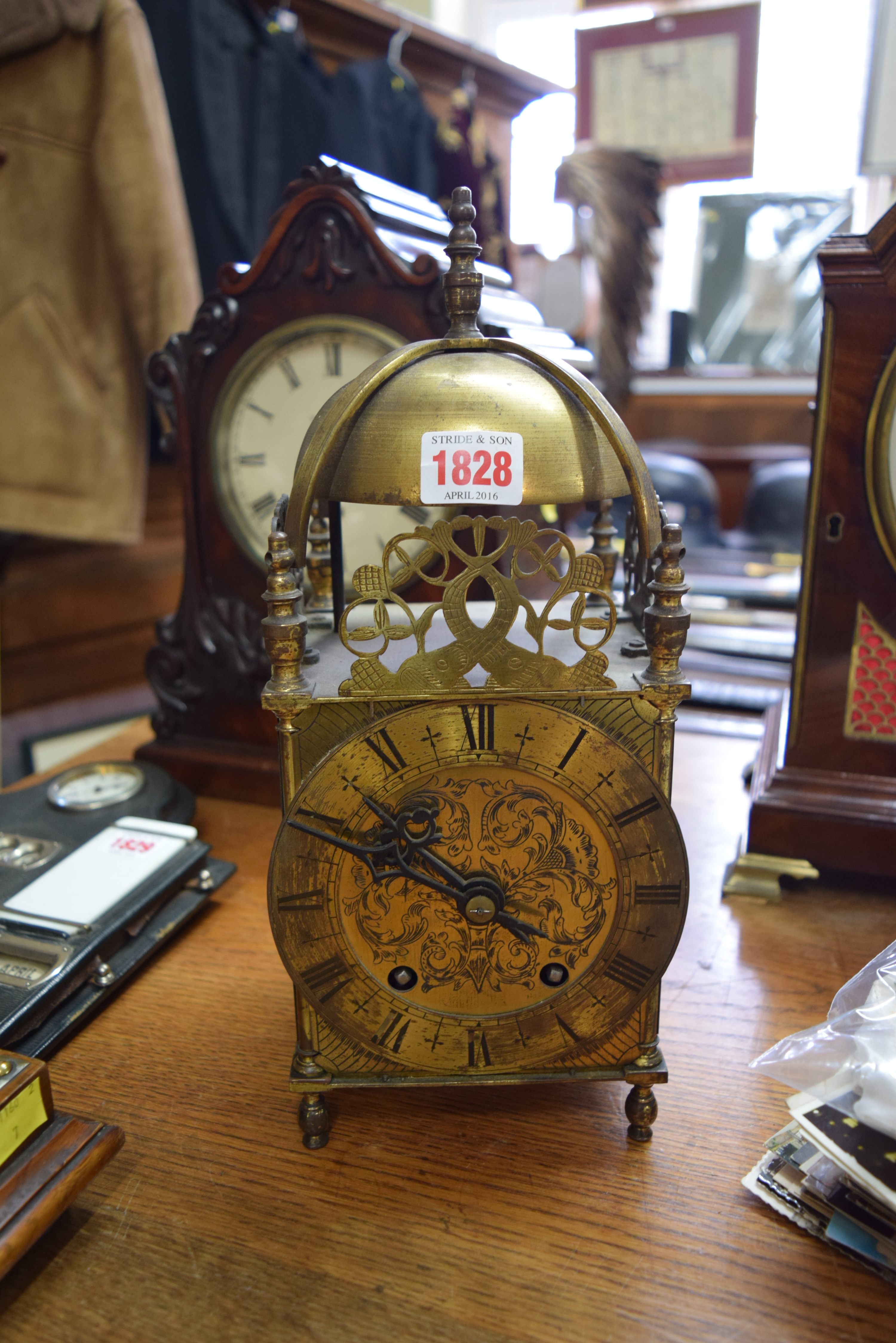 An early 20th century brass lantern style clock, 32.5cm high.