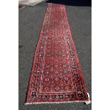 An Iranian wool runner, having diamond pattern, 496 x 89cm.