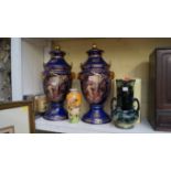 A pair of reproduction porcelain twin handled vases and covers,