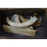 A small quantity of mother of pearl, boar's tusks and bone items.