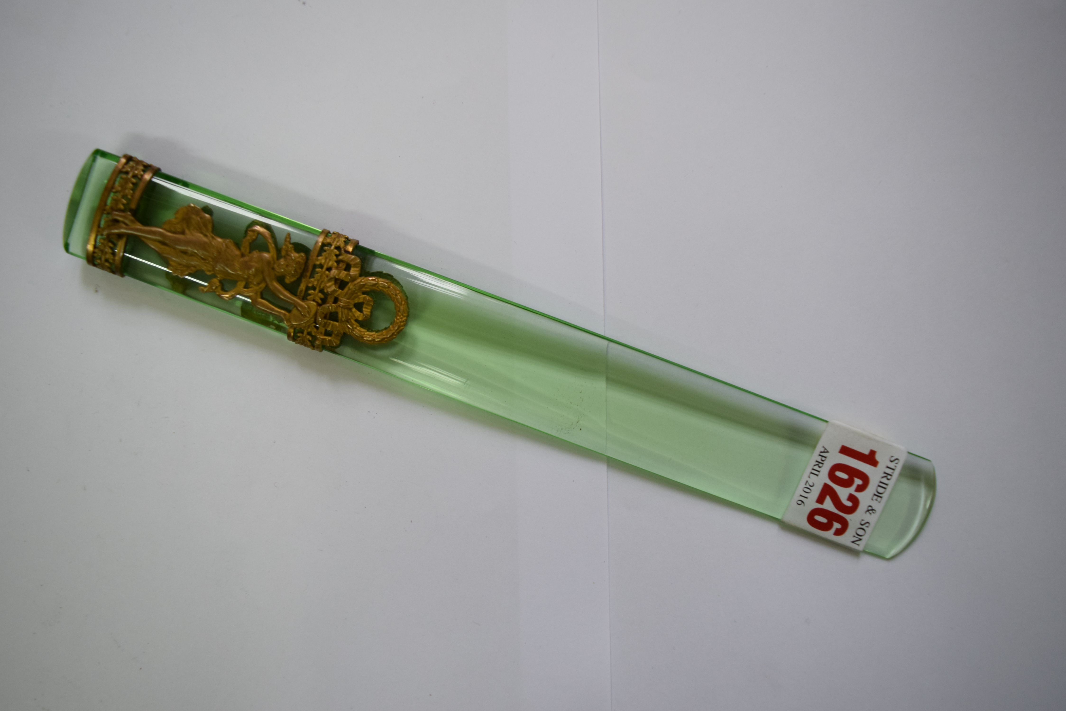 A neo-classical style gilt metal mounted green glass letter knife, 22.5cm long.
