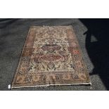 A Persian rug, having floral design, red bordered, 205 x 139cm.