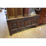 A late 17th century carved oak panelled coffer, 132.5cm wide.