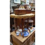 A Victorian walnut octagonal occasional table, 61.5cm wide.