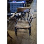 A pair of Victorian beech, ash and elm smoker's bow armchairs.