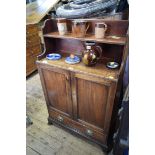 An antique mahogany waterfall bookcase, 71cm wide.