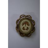 A Victorian carved ivory or bone locket form brooch.