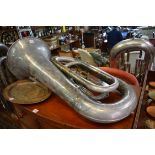 A Boosey & Co electroplated tuba, No.130353, 87cm long.