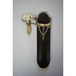 A leather and silver mounted spectacle chatelaine.