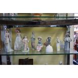 Eight Lladro figures; together with a Lladro plaque and a Lladro bell.