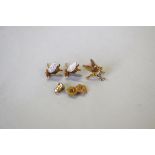 A pair of 9ct white and yellow gold bee ear studs and another single stud decorated bird, 1.9g.