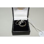 A platinum wedding band, 2.3g; and a 9ct gold wedding band, 4g.