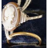 A 9ct white gold shell cameo ring; together with an 18ct gold wedding band, 2g.