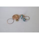 An 18ct gem set ring; together with a 9ct gold ring set cameo and a 9ct locket.