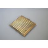 An engine turned 9ct gold cigarette case, 101g.