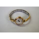 A 9ct gold Ensign ladies wristwatch, on expanding 9ct gold plated bracelet.