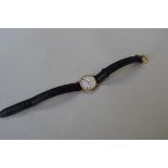 A 9ct gold Longines ladies quartz wristwatch, having white dial decorated Roman numerals,