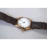 A 1920s 9ct gold gentleman's mechanical wristwatch, having white enamel 2.