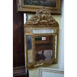 An old French gilt framed wall mirror, 55cm high x 33cm wide.