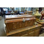 A late 19th/early 20th century Oriental carved camphorwood coffer,