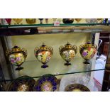 A good set of four limited edition Caverswall twin handled vases and covers,