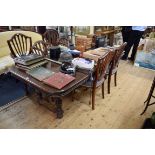 An antique French walnut dining table, with two leaf insertions, 214cm extended.