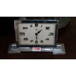 A French Art Deco chrome desk timepiece, 22cm wide.