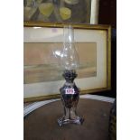 A pair of early 19th century style electroplated oil lamps, height excluding glass chimney 21cm.