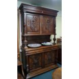 A late 19th century French carved walnut dining suite, comprising a large side cabinet, 144.