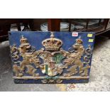 An old polychrome painted cast iron coat of arms, stamped 'Strebel', 33 x 48.5cm.
