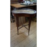 A late Victorian mahogany and inlaid kidney shaped bijouterie table, 60cm wide.