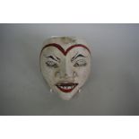 An eastern painted wood mask, probably early 20th century,