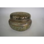 A Chinese pierced 'bronze' hand warmer, 18th century, four character seal to base, 18.5cm diameter.