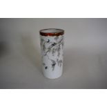 A Japanese porcelain sleeve vase, decorated with swallows amongst flowering branches, 24cm high.